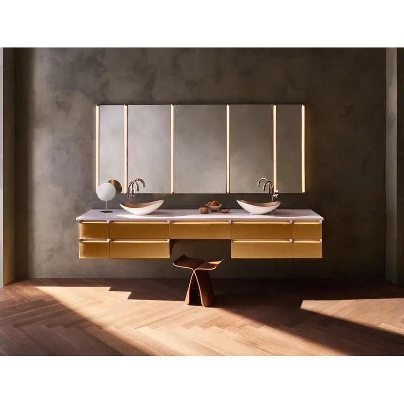 Modern bathroom with double vessel sinks, floating wooden vanity, vertical LED mirror lights, and wooden stool