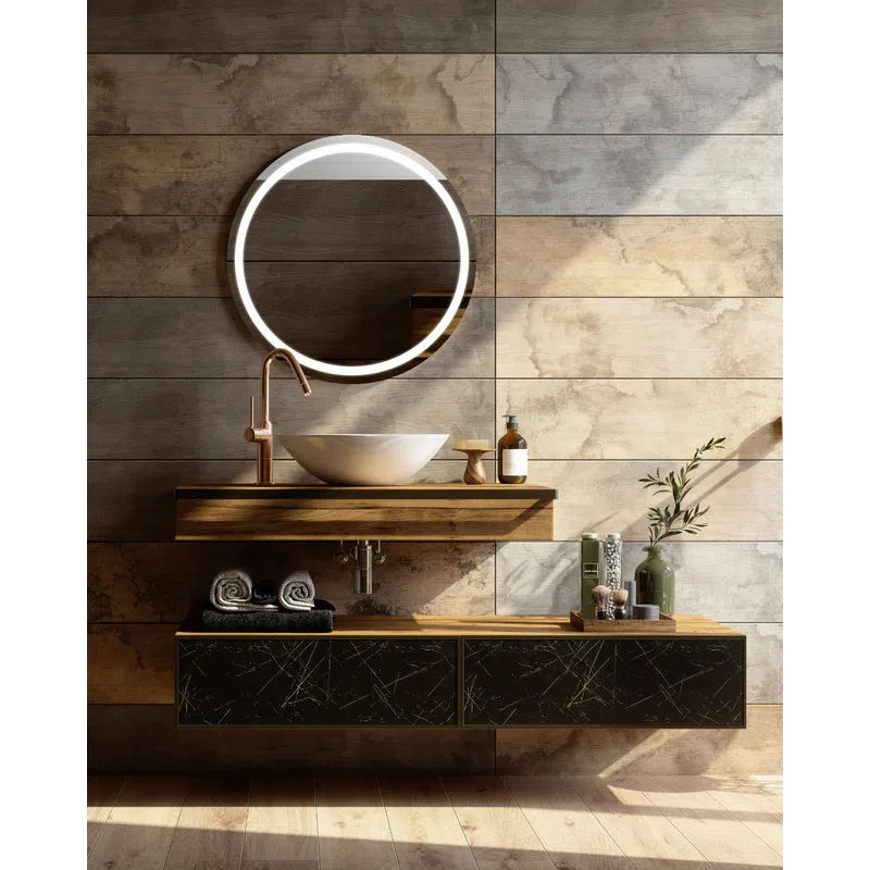 Modern bathroom vanity with round illuminated mirror, vessel sink, wooden shelves, and decorative items.