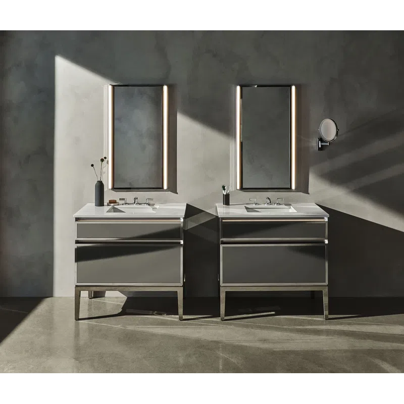 Modern double bathroom vanity with illuminated mirrors and minimalist decor against a concrete wall.