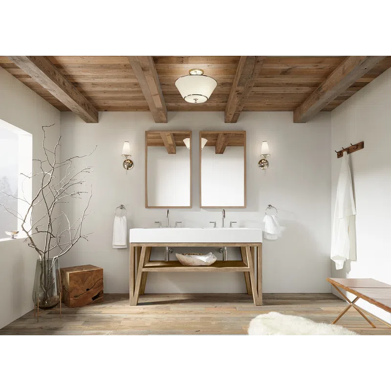 Modern rustic bathroom with wood beamed ceiling, double sinks, large mirrors, and minimalist decor