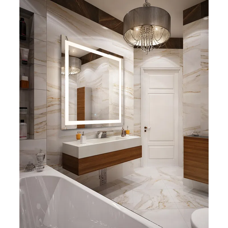 Modern bathroom with marble walls, floating wood vanity, illuminated mirror, and elegant chandelier lighting.