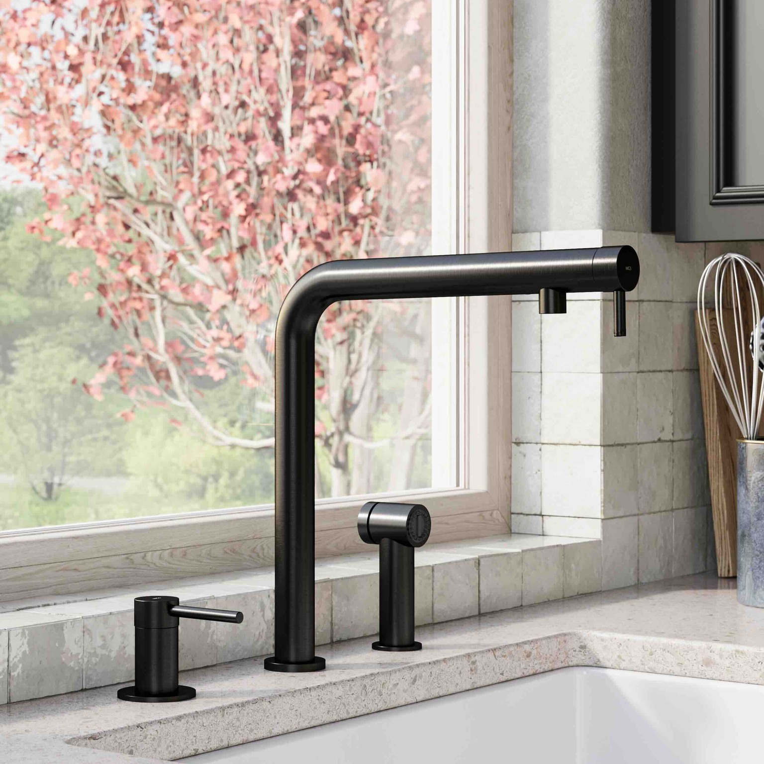 Modern black kitchen faucet with soap dispenser and sprayer by a window showing a blooming tree outside.
