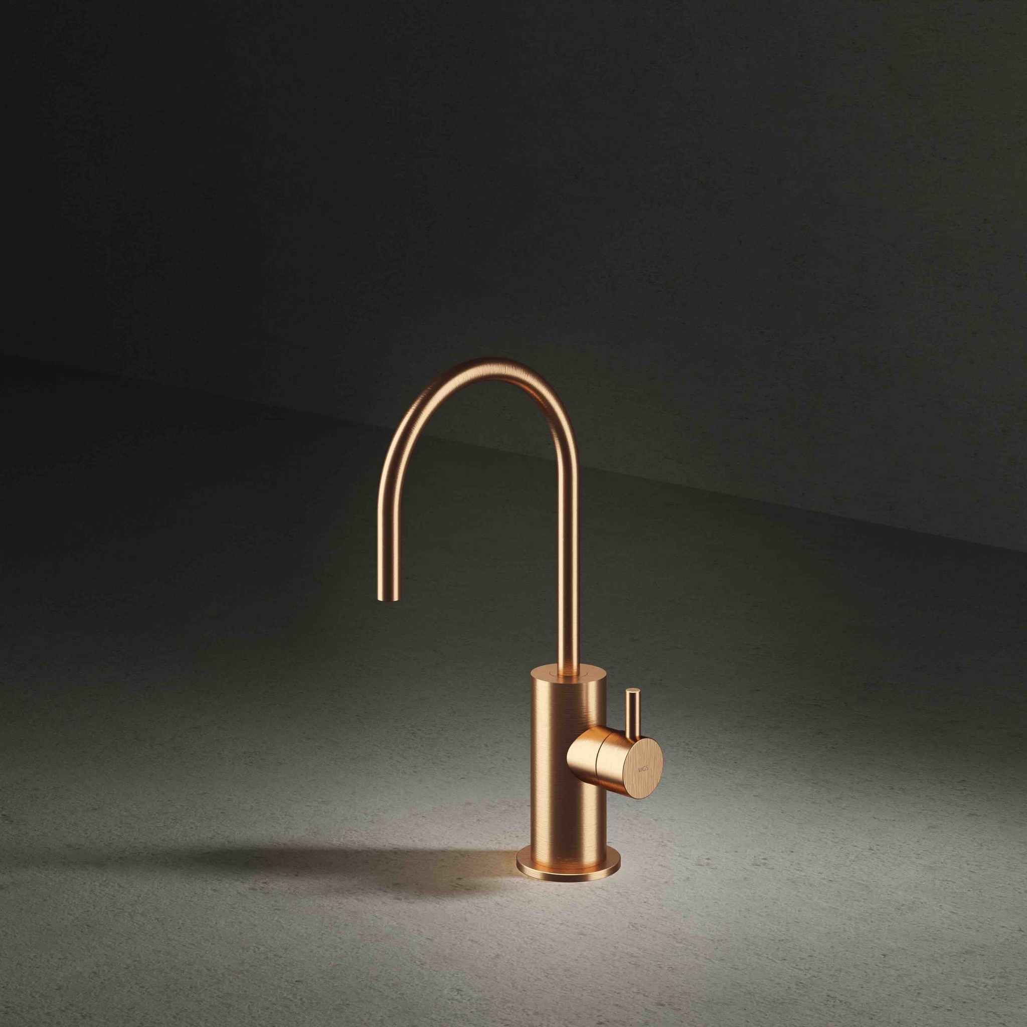 Sleek modern copper kitchen faucet with curved spout and single lever handle on dark surface.