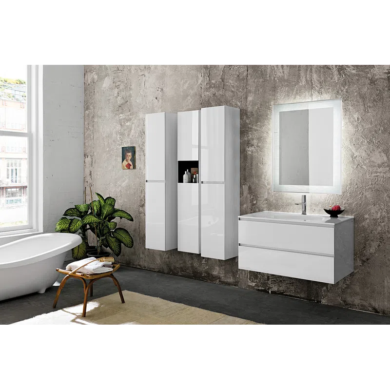 Modern bathroom with freestanding tub, floating white cabinets, illuminated mirror, and a green plant by textured wall.