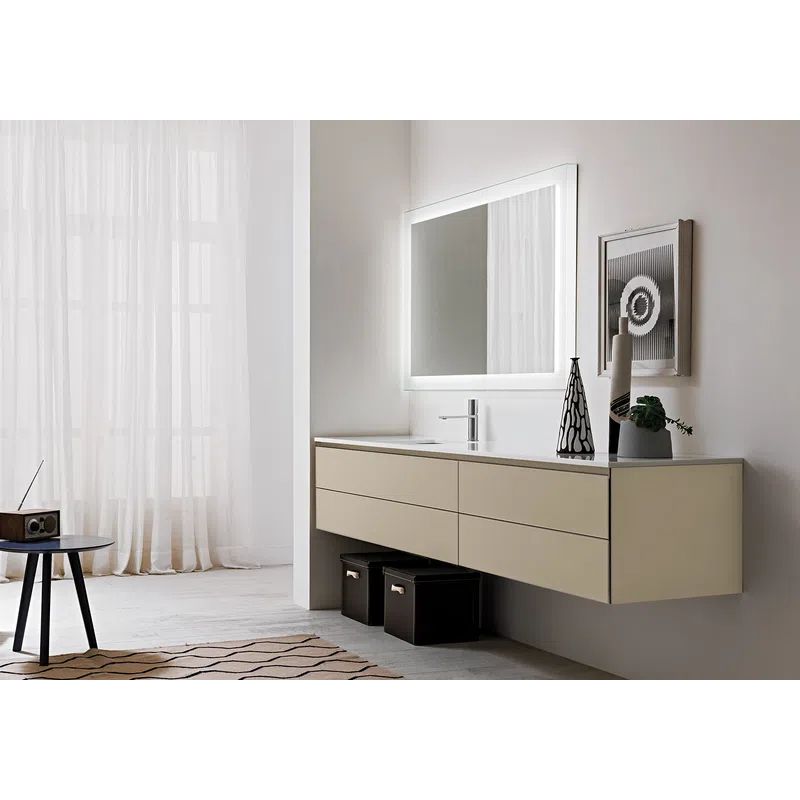 Modern minimalist bathroom with floating vanity, lit rectangular mirror, decorative vases, and sheer window curtains.