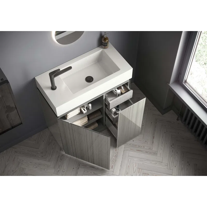 Modern bathroom vanity with white rectangular sink, matte faucet, open cabinets, and wooden herringbone floor