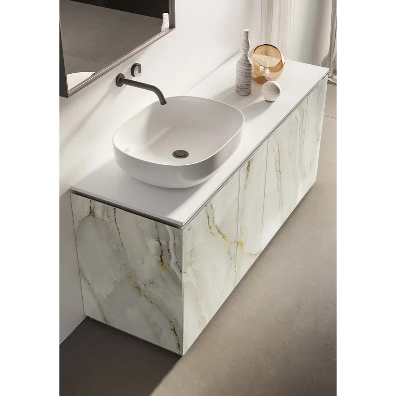 Modern bathroom vanity with white vessel sink, wall-mounted faucet, marble cabinet, and decorative vases.