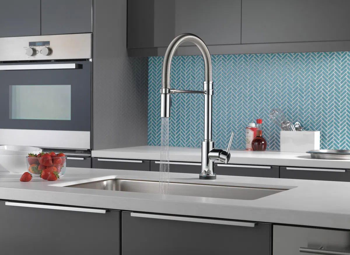 A kitchen with a sink and a faucet