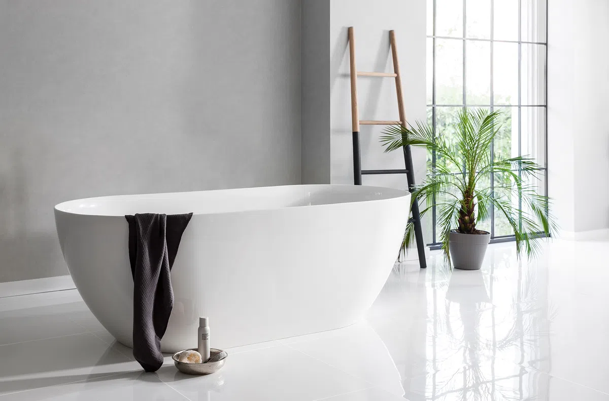 A bathtub with a towel from the side