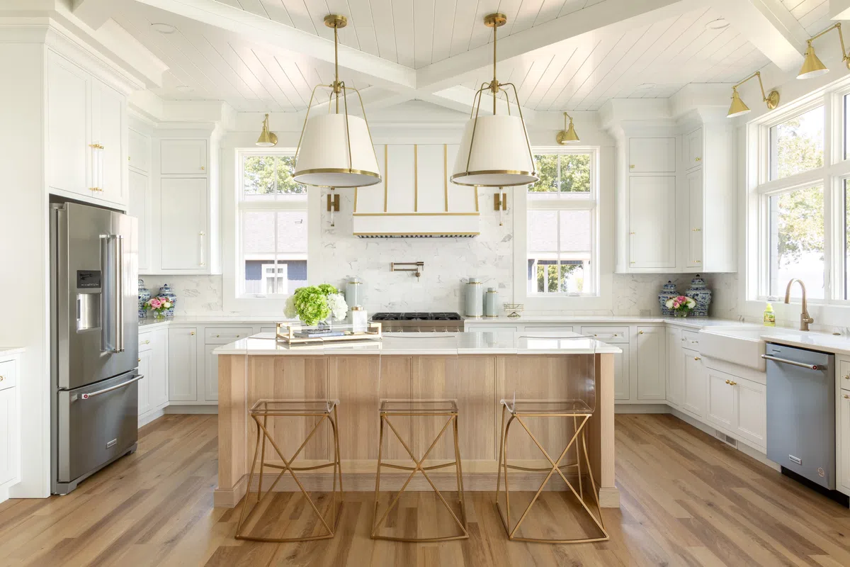 A kitchen with white cabinets