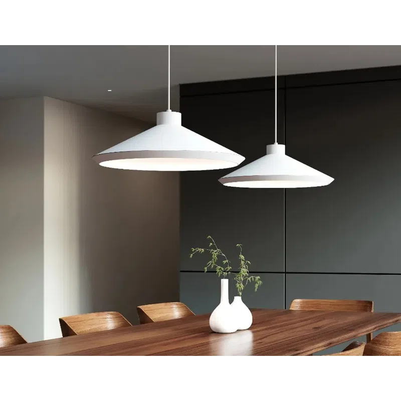 Modern dining room with wooden table, chairs, white pendant lamps, and decorative white vases with greenery.