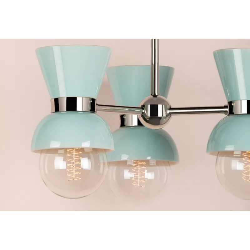 Modern chandelier with three pastel blue shades and exposed filament bulbs against a beige background