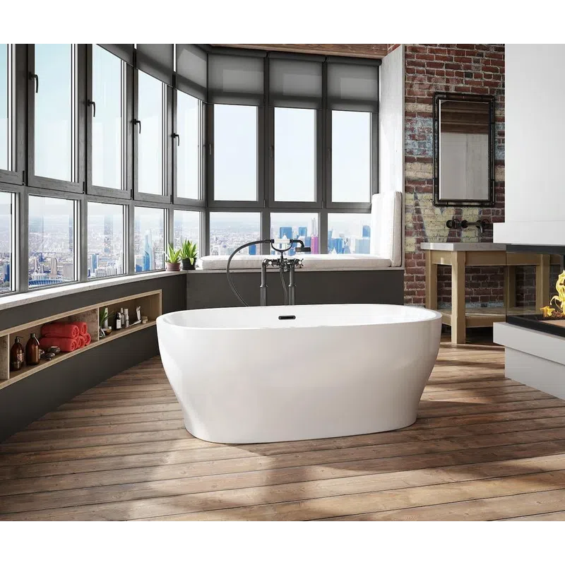 Modern bathroom with freestanding tub, large windows, city view, exposed brick wall, and wooden flooring.