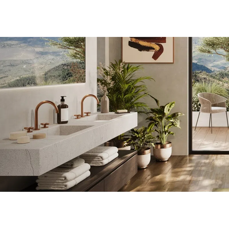 Modern bathroom with double sinks, copper faucets, indoor plants, mountain views, and wood flooring.
