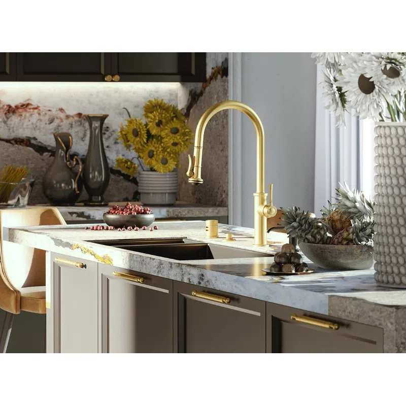 Modern kitchen with gold fixtures, marble countertops, sunflowers in vase, and crystal chandelier lighting.