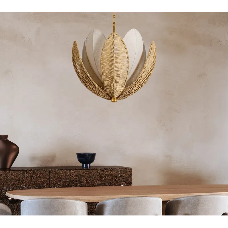 Elegant dining room with beige chairs, wooden table, unique leaf-shaped pendant light, and textured sideboard.