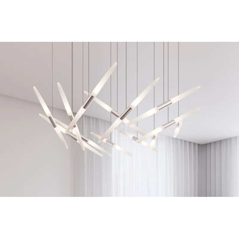 Modern geometric white chandelier hanging in a bright room with sheer curtains and potted plants.