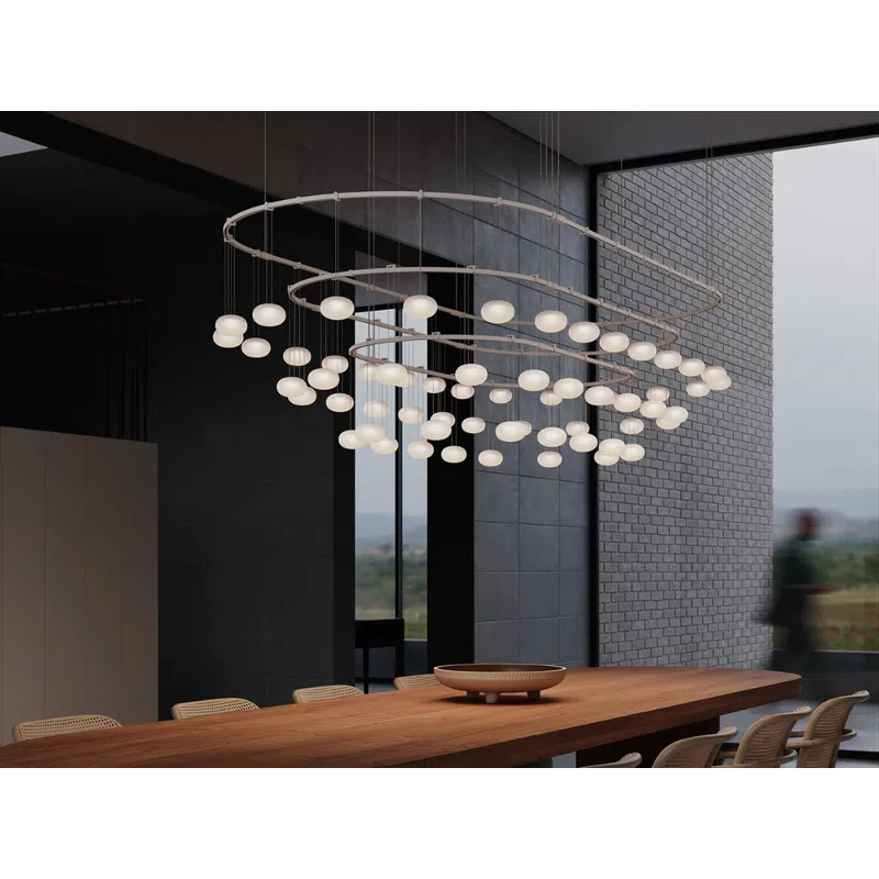 Modern dining room with large wooden table, rattan chairs, and spiral LED chandelier over the table.