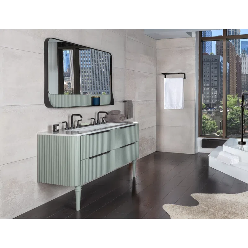 Modern bathroom with green vanity, large mirror, freestanding tub, dark wood floor, and city view through tall windows