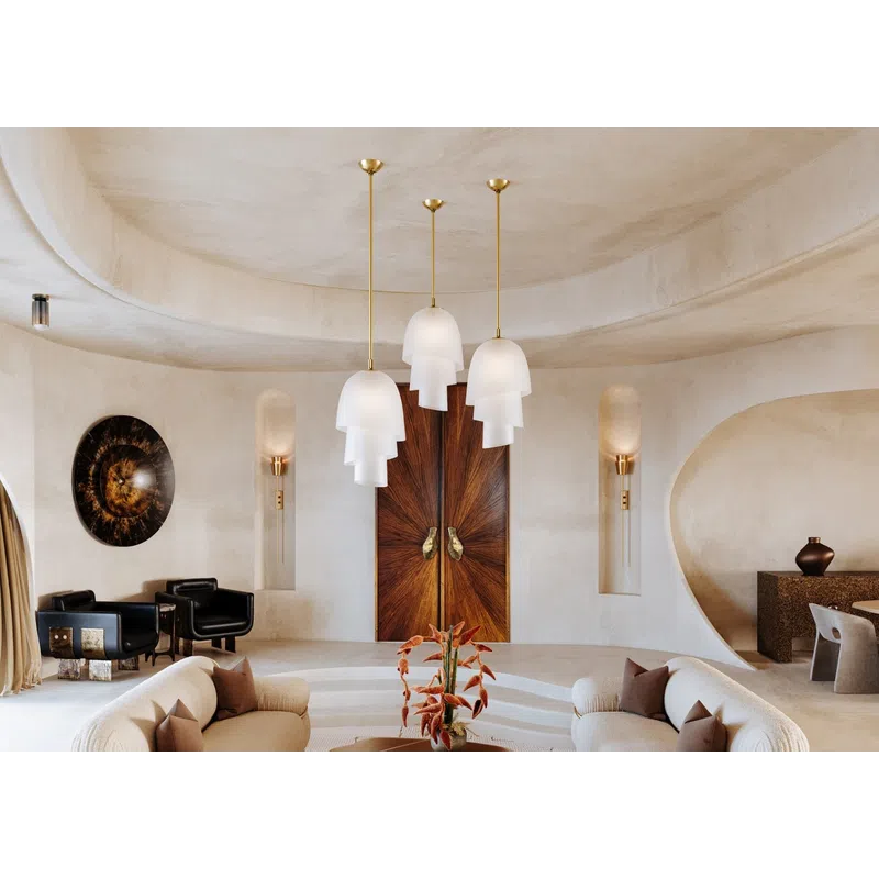 Modern living room with curved beige sofas, layered pendant lights, and sculptural wooden doors in a minimalist space.