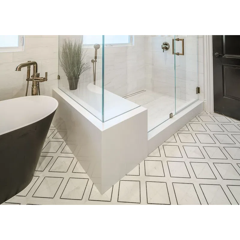 Modern bathroom with glass shower enclosure, freestanding tub, geometric floor tiles, and white marble walls.