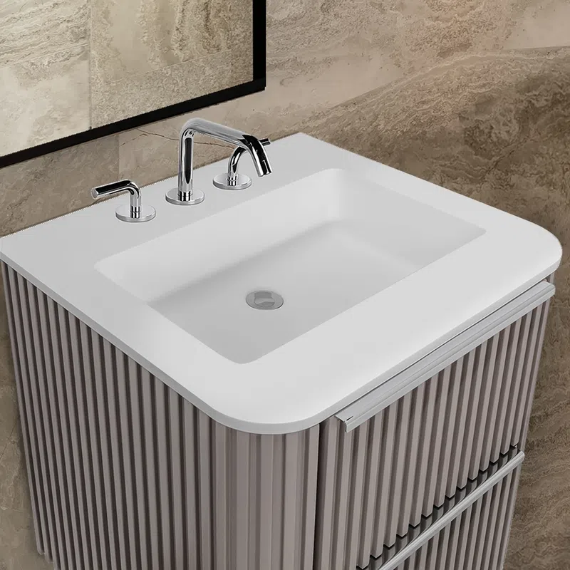 Modern bathroom sink with white rectangular basin, chrome faucet, and textured vertical striped vanity cabinet.