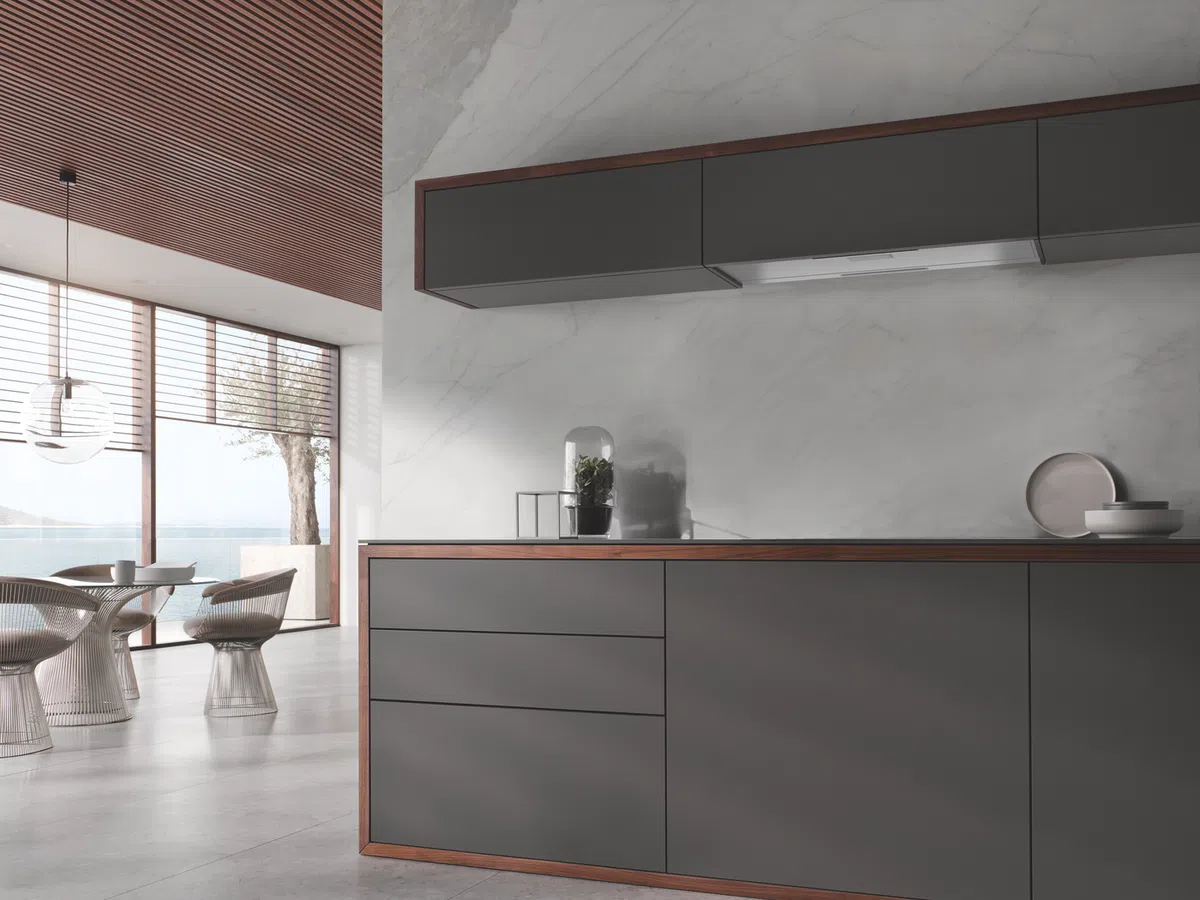 A kitchen with a bar and chairs