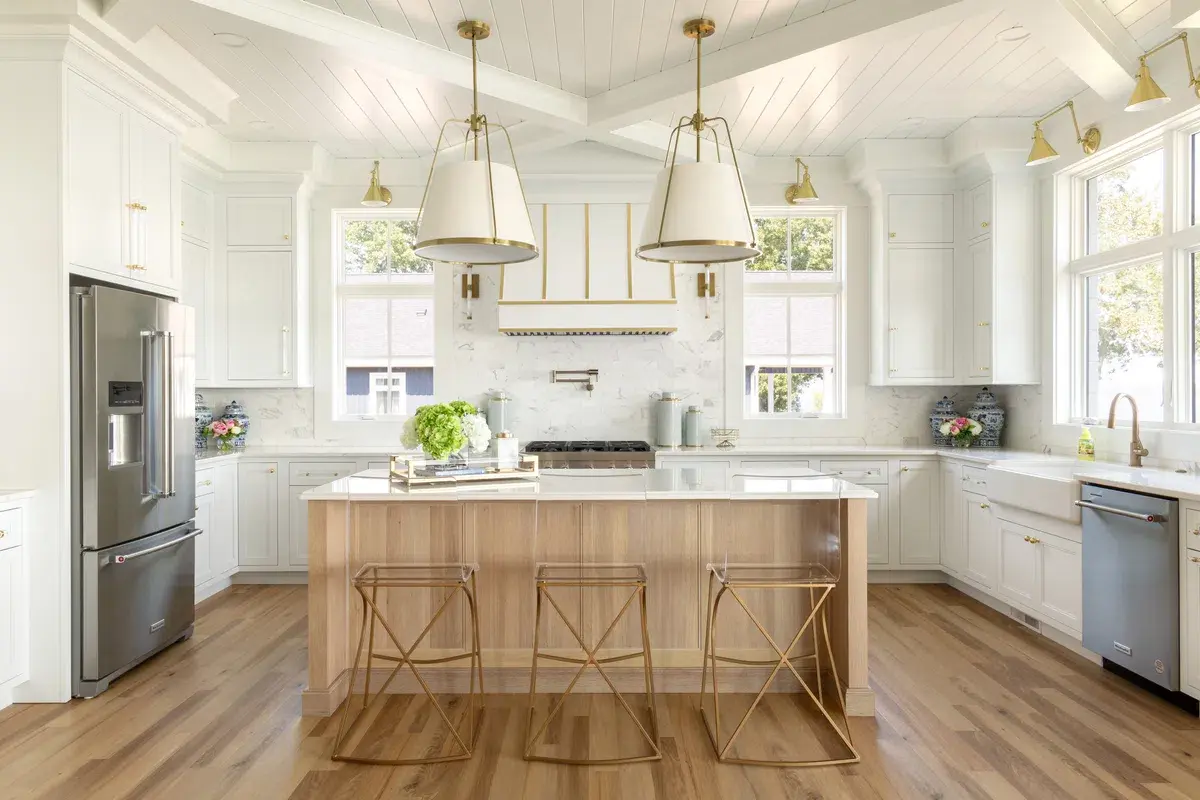 A kitchen with white cabinets