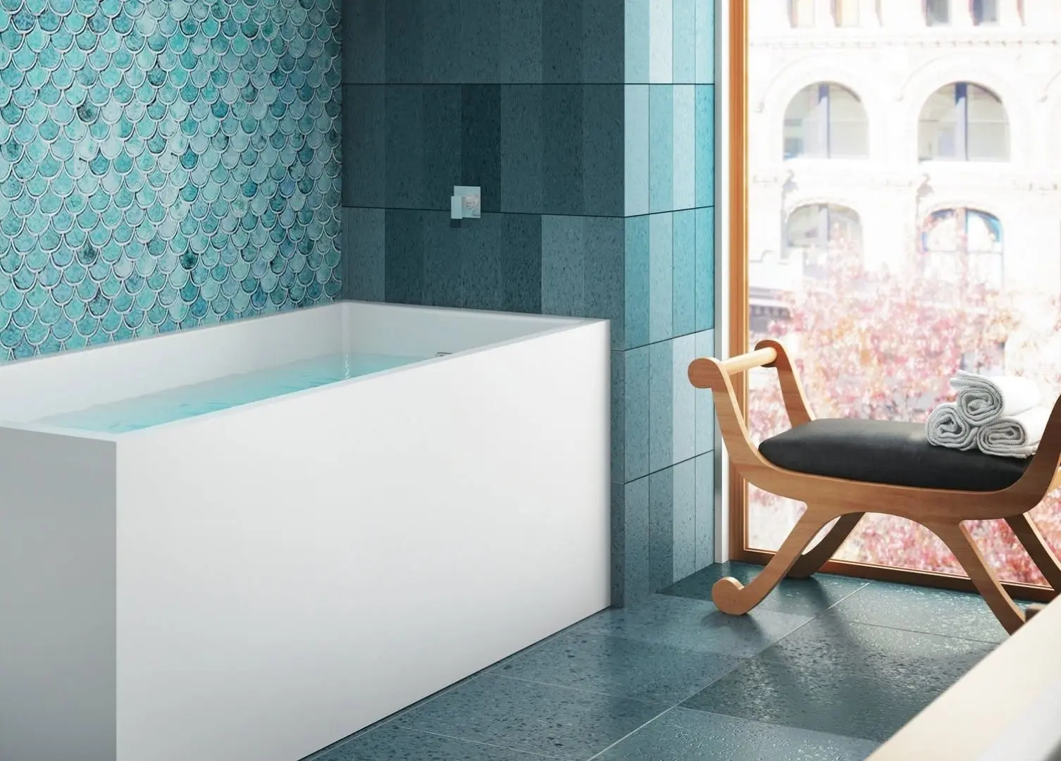 White pedestal-style freestanding bathtub in a staged showroom display