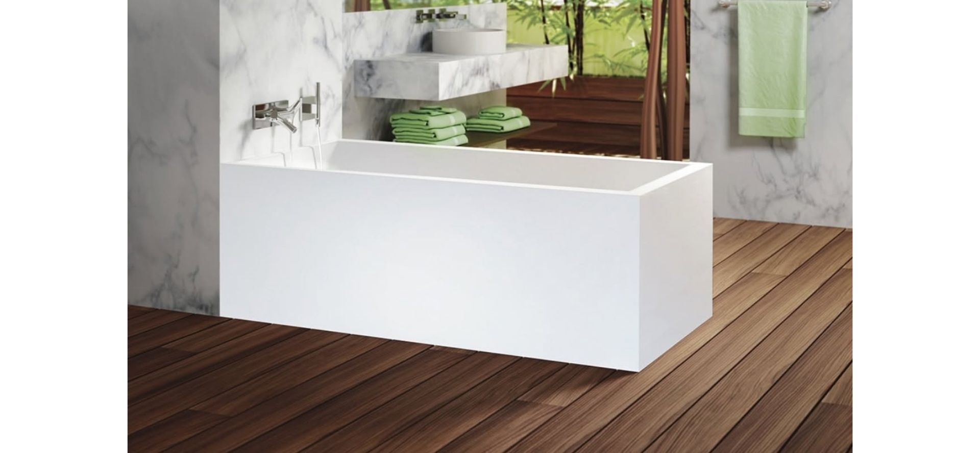 Modern white bathtub on wooden floor with green towels and marble walls in a bright bathroom