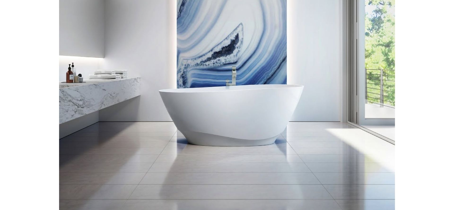 Modern bathroom with freestanding white bathtub, marble countertop, and large blue agate wall art