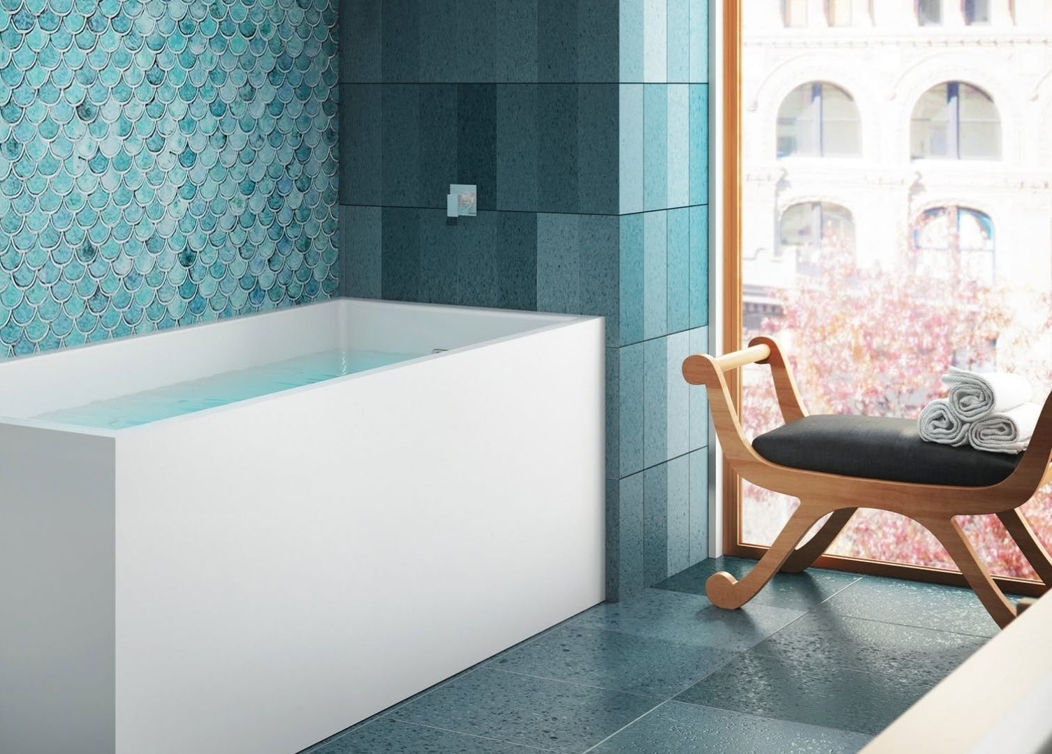 White pedestal-style freestanding bathtub in a staged showroom display